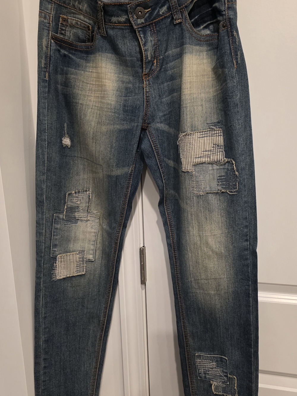 Woman's Distressed Patchwork Blue Jeans